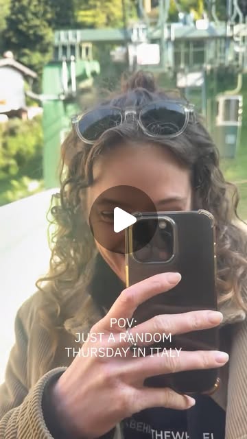 Tess taking a selfie in a chairlift at Lago Maggiore: "POV: Just a random Thursday in Italy"